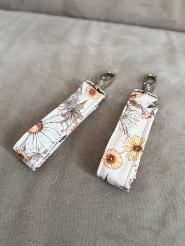 Zaczepy do wózka na torbę lub plecak rumianek